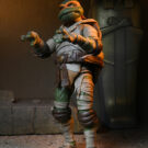 NECAOnline.com | Universal Monsters/Teenage Mutant Ninja Turtles - 7" Scale Action Figure - Ultimate Michelangelo as The Mummy