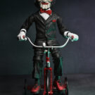 NECAOnline.com | Saw - 12" Action Figure with Sound - Puppet on Tricycle